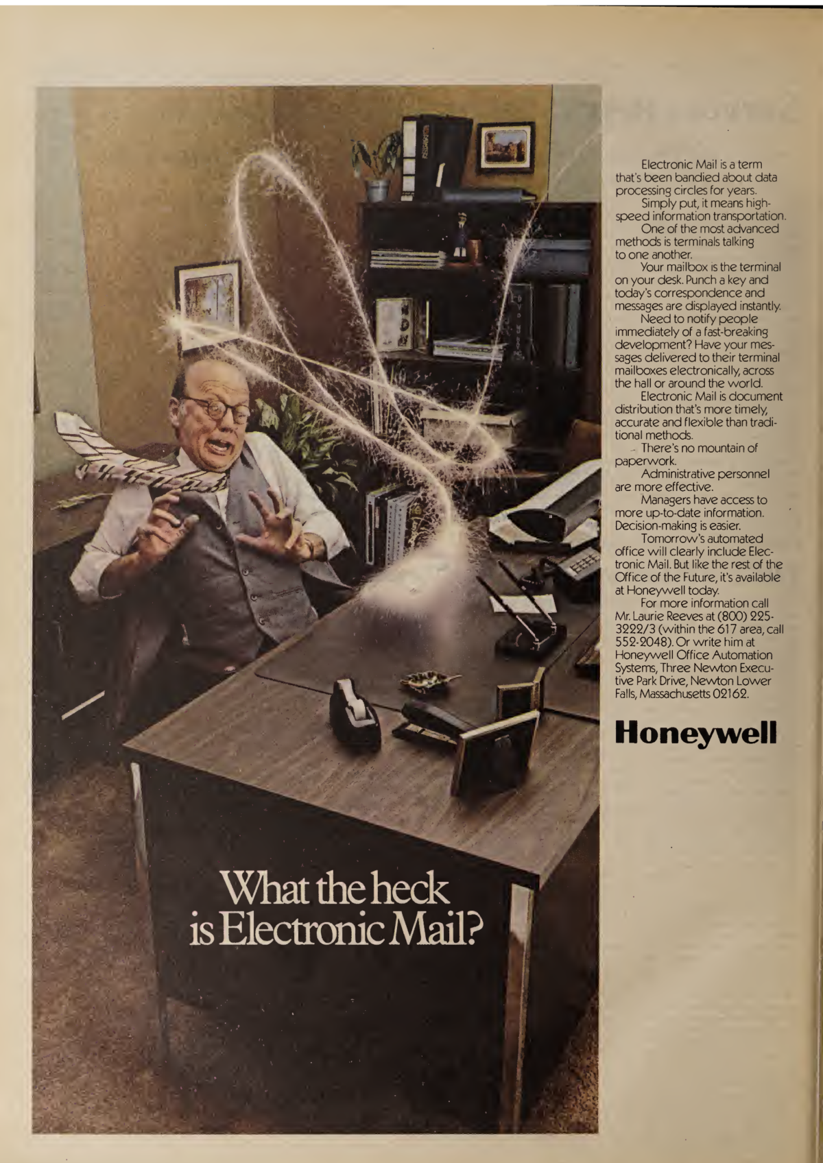 A shocked business man is jumping back away from his desk after a glowing envelope zooms onto his desk seemingly from nowhere. The headline reads “What the heck is electronic mail?”